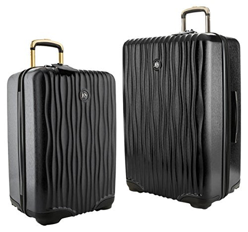 A SET OF FOUR BLACK TAIGA LEATHER HARDSIDED ALZER 60, 65 & 80 SUITCASES